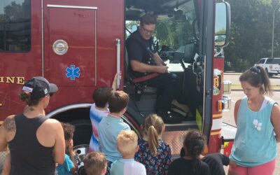 Families enjoy fire truck exploration and popsicle crafts at Heritage Park